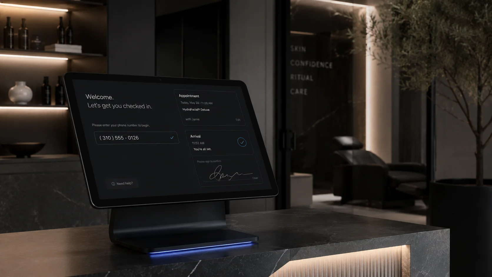 A dark premium reception desk with a tablet check in kiosk